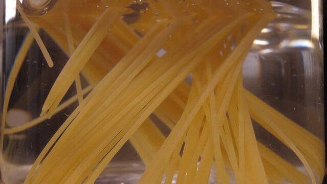 spaghetti pasta on pot with boiling water 4k