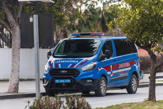 Side, Turkey -January 29, 2022:  blue Ford Transit Jandarma is parking  on the street on a  summer day against the backdrop of a park