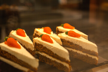 Delicious carrot cake on the counter in the cafe. Selective focus