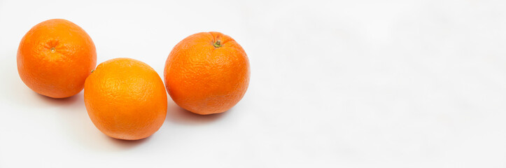 juicy oranges on a white background. sweet big tangerines on the table.orange citrus fruits on a light texture