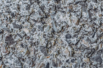 Abstract real photo grunge background. Light Grey gravel concrete asphalt road macro close up texture surface shot. Design, wall decorative trim