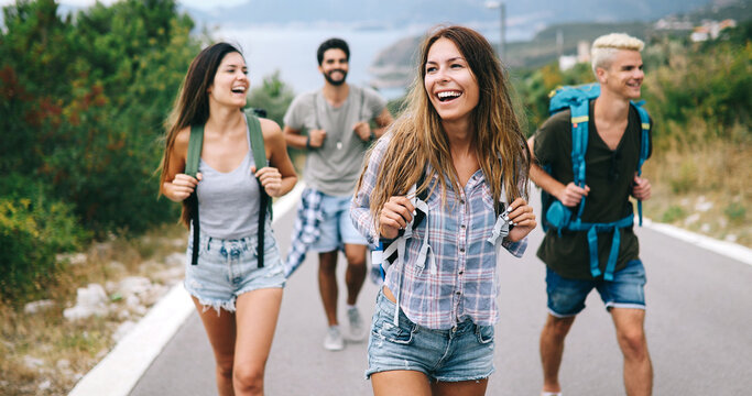 Group of happy friend traveler walking and having fun. Travel lifestyle and vacation concept
