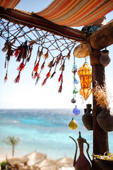 Sea view from an authentic cafe with handmade lamps and decorations. Egypt. High quality photo