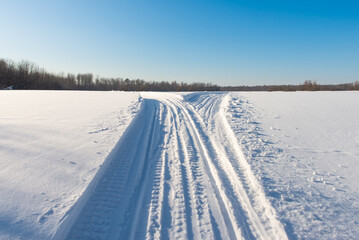Snowmobile road close up. Winter landscape