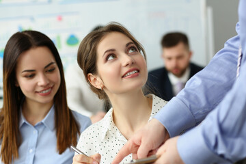 Young lady listen to qualified colleague, man gives advice about work project