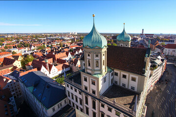 Fototapeta premium Augsburg, Bavaria, Germany, view over the historic townhall and the Maximilan Street in bright sunshine to highlight the beauty of the swabian town With view of the Alps due to a weather phenomenon.