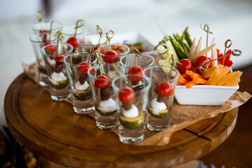 Decorated catering banquet table with different food appetizers assortment on a party