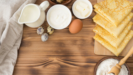 Top view of the table on which pancakes are being prepared