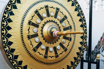 Golden gong of a temple in the grounds of the Wat Saket (Phu Khao Thong) in Bangkok, Thailand