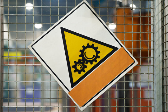 old Rotating Gears Symbol Sign in industrial landscape with blank space for text