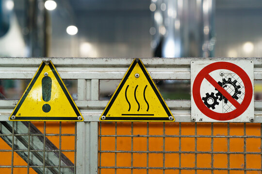 Old industrial safety sign. Warning safety sign inside a factory