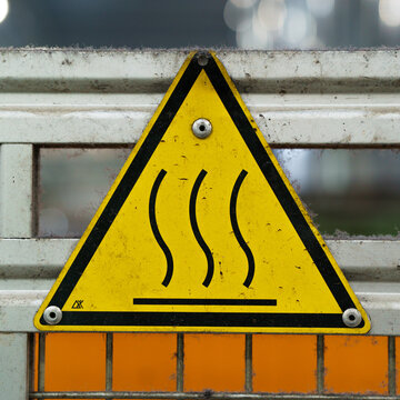 Old industrial safety sign. Warning safety sign inside a factory