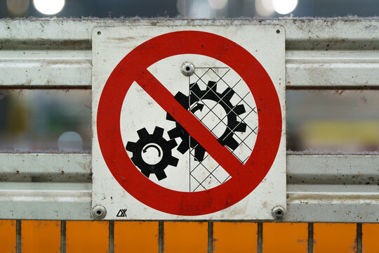 Old industrial safety sign. Warning safety sign inside a factory