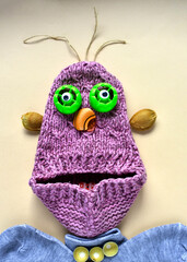 portrait of a cute  monster made from a knitted slipper, creative, fantasy of children.