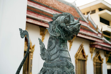 A close-up of an animal statue at a Thai temple in Bangkok