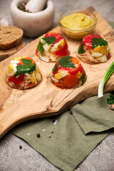 Portion of delicious chicken aspic on serving board on concrete table