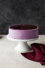 Traditional German cheesecake with lavender and blueberry. Slice of mousse cake, cheesecake with fresh berry on a white  background