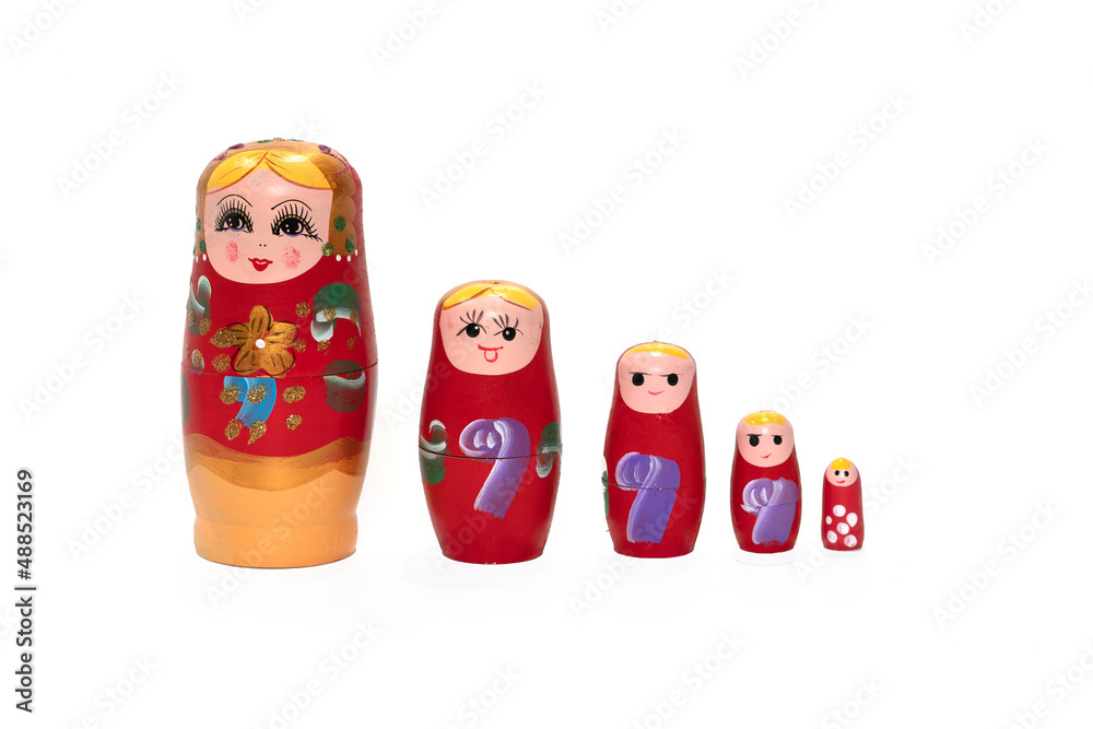 Wall mural Bright colored nesting dolls on a white background. Russian national souvenir