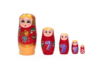 Fototapeta na wymiar Bright colored nesting dolls on a white background. Russian national souvenir