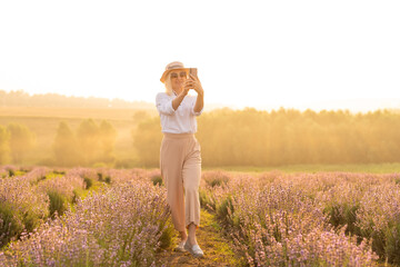 A Woman Walking in Lavender Field