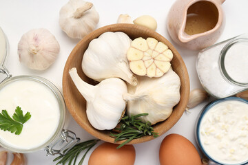 Concept of cooking garlic sauce on white background