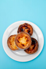 typical portuguese dessert pastel de nata on plate