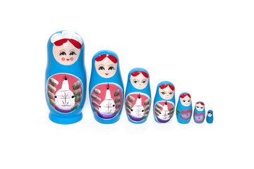 Blue colored nesting dolls on a white background. Russian national souvenir.