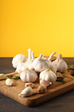 Ingredients for cooking garlic sauce on dark wooden table