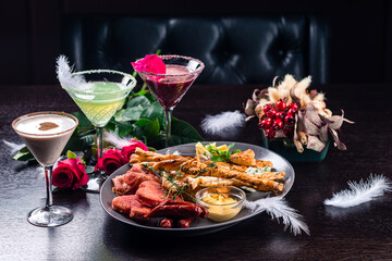 Three different beautiful cocktails on a flower background. cocktail or bar menu concept.