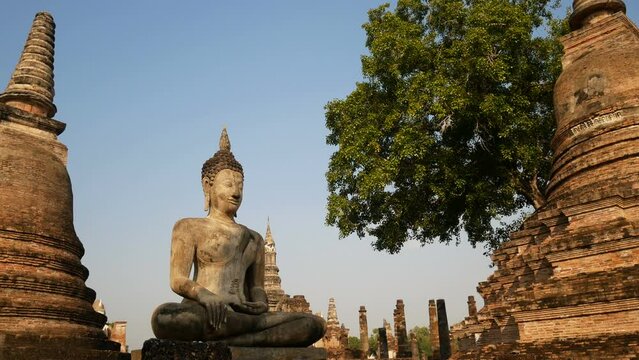 statue of ancient buddha in Mahathat old temple in Sukhothai Historical Park, a UNESCO World Heritage Site.the famous landmark place for tourist sight seeing attraction in Sukhothai, northern Thailand