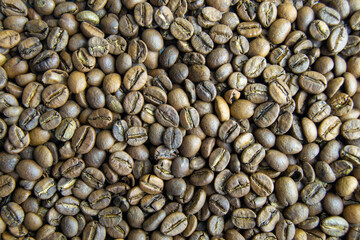 roasted coffee beans close-up. invigorating drink. power engineering specialist. Horizontal image