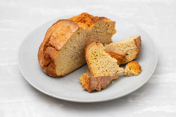 typical portuguese corn bread on gray plate on ceramic