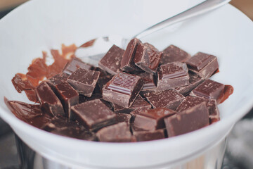 Melting cubes of dark chocolate