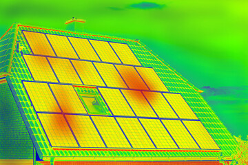Thermographic inspection of photovoltaic systems by house.Thermovision image of solar panels. Infrared thermovision image. Infrared thermography in inspection of photovoltaic panels.  - obrazy, fototapety, plakaty