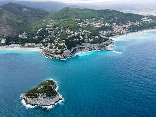 Fototapeta premium Aerial view of Bergeggi island, heart island from above, in Liguria, north Italy. Drone photography of the Ligurian coast, province of Savona with Spotorno and the island of Bergeggi.