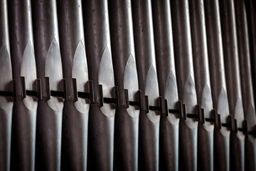 A full frame photograph of church organ pipes