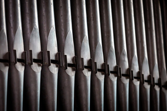 A full frame photograph of church organ pipes