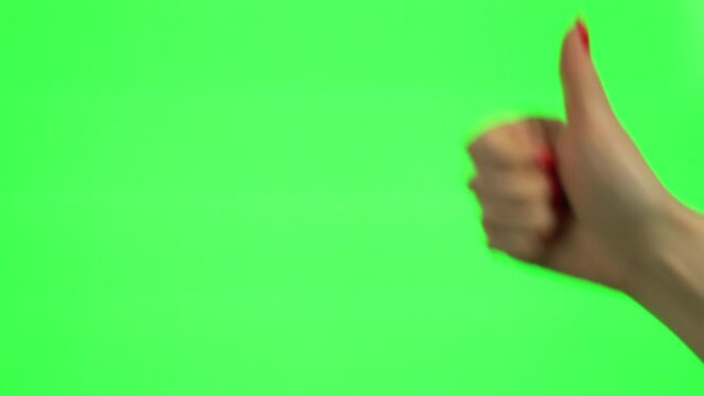 Gestures. Thumbs up on Green Screen, Green Background, Alpha Channel, Chroma Key, Mockup. Ledy with Red Manicure Showing Thumbs Up Gesture. Positive Gestures, Gesticulation.