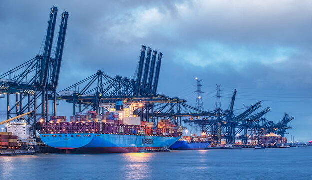 ANTWERP-DEC. 25, 2021. Large container terminal with moored vessels at night. The Port of Antwerp in Flanders, Belgium is the second-largest seaport of Europe, after Rotterdam in the Netherlands.