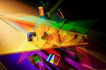 Artistic dispersion of artificial light, dichroic square glass cube and horizontal stripe...