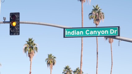 Palm trees and blue sky, Palm Springs resort city near Los Angeles, street road sign, semaphore...