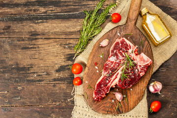 Classic T-bone steak isolated on white background. Hard light, dark shadow, mockup, template