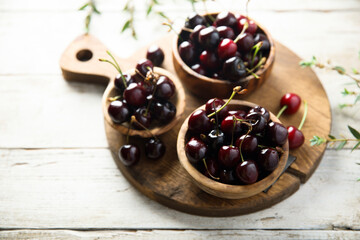 Fresh cherry served in wooden bowls