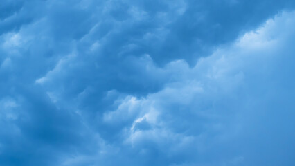 Dark blue skies. Stormy during a thunderstorm. The sky before a hurricane. Background image.