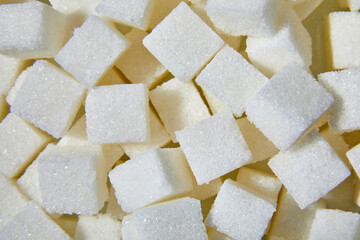 Flat lay macro white sugar cubes close up texture background
