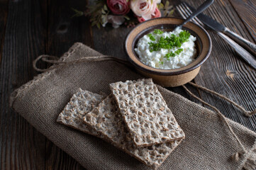 Diabetic food with whole grain crispbread, cottage cheese and herbs