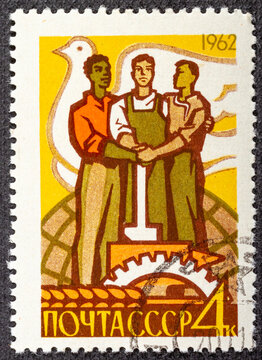 RUSSIA - CIRCA 1962: stamp printed by Russia, shows Workers of three races and dove, circa 1962