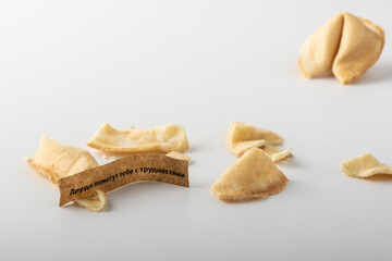 Broken traditional chinese paper tape fortune cookie. You can see the prediction 