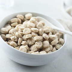 Healthy organic bran in a white bowl