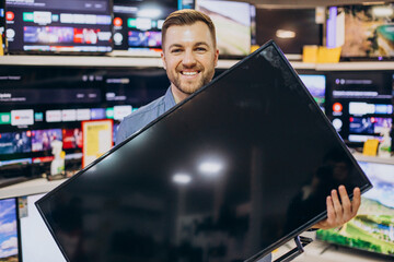 Man buying television at store
